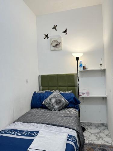 Postel nebo postele na pokoji v ubytování Tanih Place