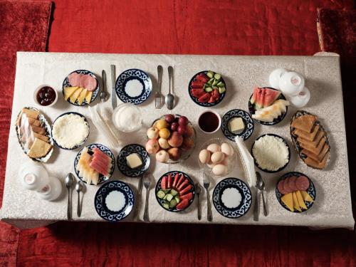 een bord met verschillende soorten desserts bij BRICK PALACE in Samarkand