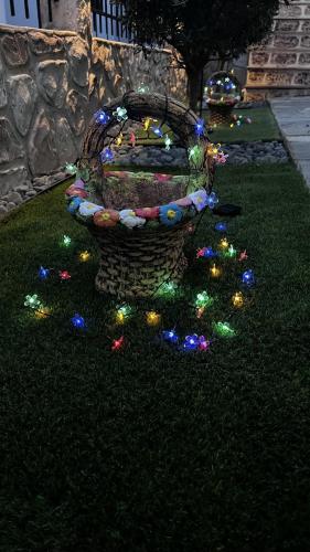 a group of lights on the grass in a yard at Heraklia villa sea view pool & jacuzzi in Nea Iraklia