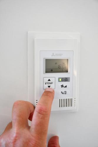 a hand is turning on a light switch at Roatel Hirschberg an der Bergstraße (A5) my-roatel-com in Hirschberg an der Bergstraße