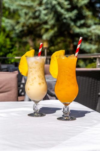 two drinks sitting on top of a table at Hotel St. Pankraz in San Pancrazio dʼUltimo
