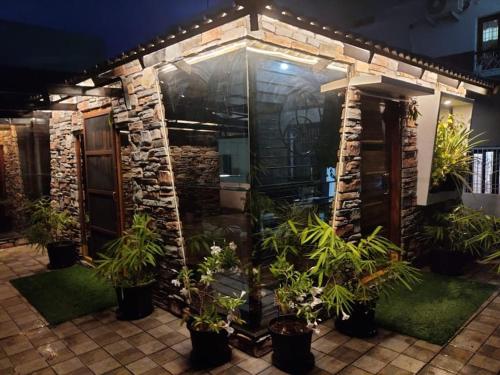 a house with plants in front of it at night at Bandarus Green Haven in Rājahmundry