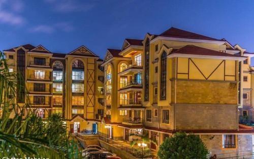 a group of buildings in a city at night at KenGen Furnished and Serviced Apartments in Nairobi