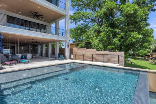 a swimming pool in the backyard of a house at The High Life with Concierge Services in Kingsland
