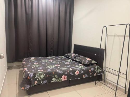 a bed in a room with a black curtain at Felina Homestay Condo Selayang Batu Caves MusIim Friendly in Kuala Lumpur