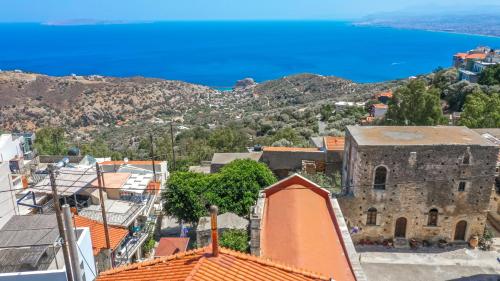 an aerial view of a town with the ocean in the background at RODIBLUE VILLAGE Apartments in Rodia