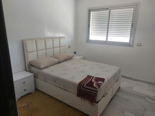Postel nebo postele na pokoji v ubytování Joli appartement vue sur mer