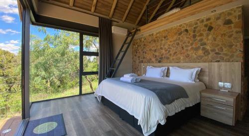 Postel nebo postele na pokoji v ubytování Hillside lodge