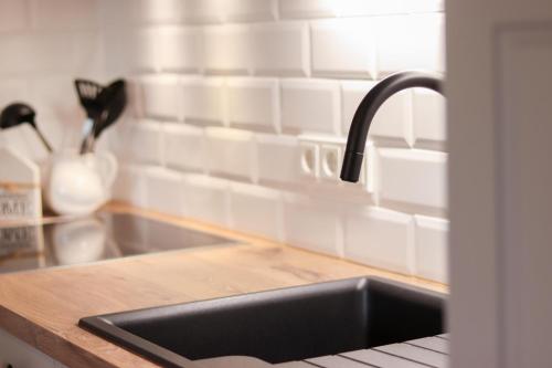 a kitchen with a sink and a counter top at Ferienhof Mayischhof in Lauperath