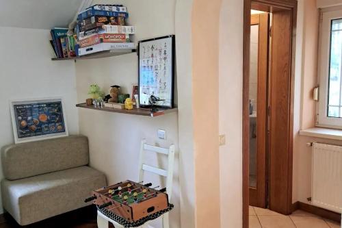 a living room with a chair and a stair case at Ramonda house in Brestovik