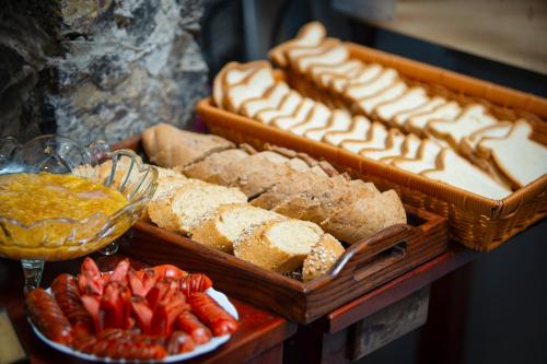 a display of bread and other food on a table at Tam Coc Mountain Sunset and Garden Hotel in Ninh Binh
