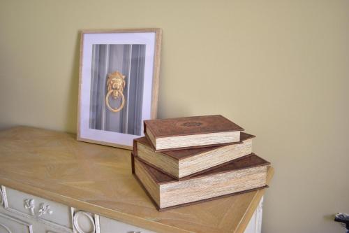 a stack of wooden boxes on a counter with a mirror at Grand Arcanum Apartment 2 - Comfortable and Elegant in Senglea