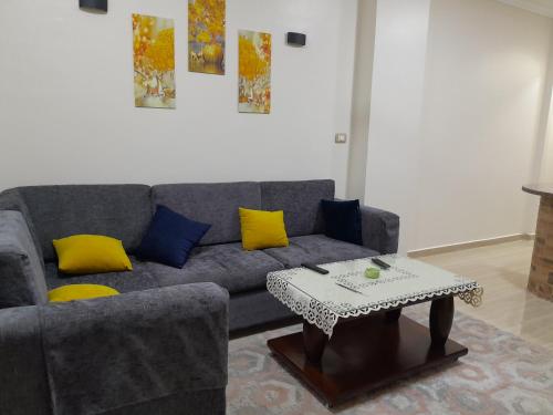 a living room with a couch and a coffee table at El Gabal in Makadi Bay