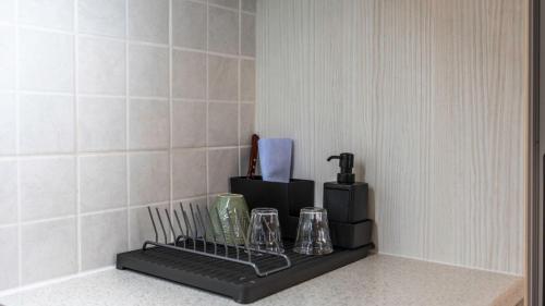 a kitchen counter with a coffee maker on a shelf at Heraklion Crete Monis Prevelis 74 3BRS 2BTHS Fast WiFi in Bendevís