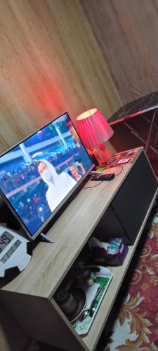 a table with a laptop computer on top of it at MAMA DELiGHT HOME in Abu Dhabi