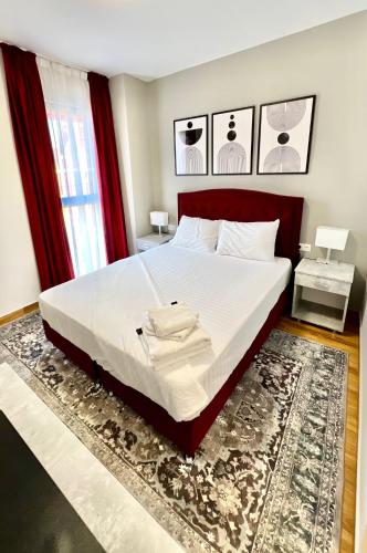 a bedroom with a large bed with a rug at Hotel Fantazia Oradea - Self Check In & Out in Oradea