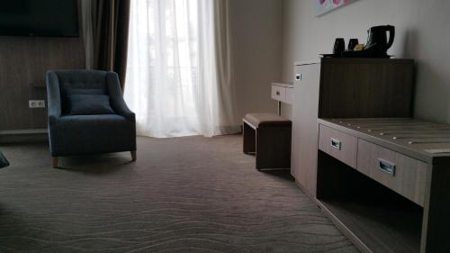 Posezení v ubytování Brit Hotel de Grignan Vichy