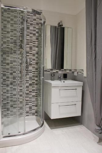 a bathroom with a shower and a sink and a shower at BSuites Apartment in Padova