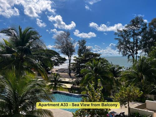 a view of the ocean from a resort with a swimming pool at By the Sea- Pool and Sea View in Batu Ferringhi
