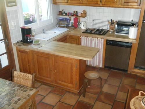 a kitchen with a sink and a counter top at Entre mer et montagne in Hasparren