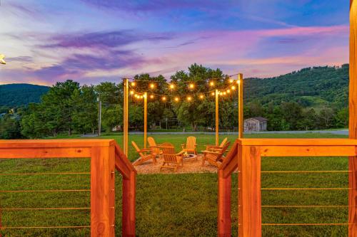 a gazebo with chairs and lights in a yard at Utopian Bliss in Sevierville