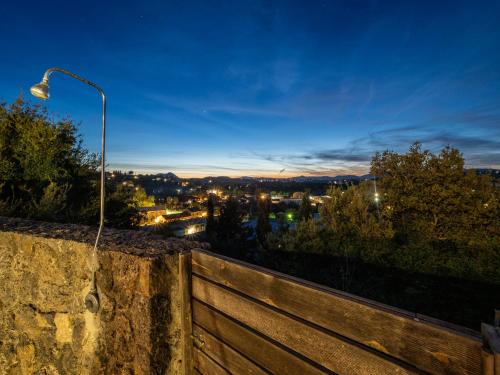 a street light on top of a stone wall at Villa Althea 1 in Kompítsion