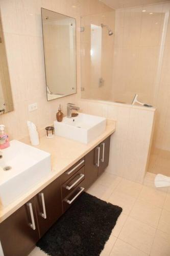 a bathroom with a sink and a mirror at Beach Side Escape-Playa Blanca in Río Hato