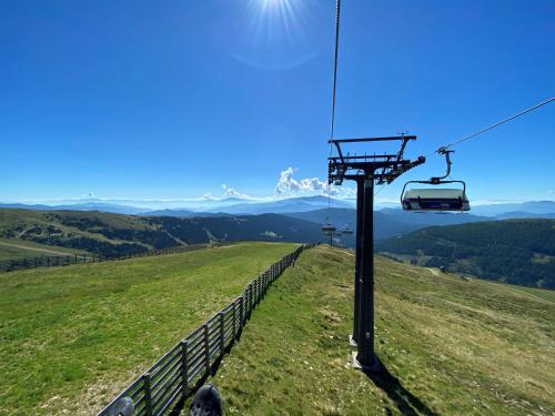 a gondola on top of a grassy hill at Sonnberg Chalet - Entspannung pur im Luxus Chalet mit Whirlpool-Sauna in Lachtal