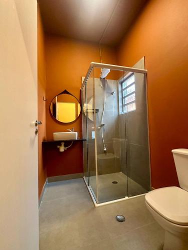 a bathroom with a shower and a toilet at Hostel Distrito 011 in Sao Paulo