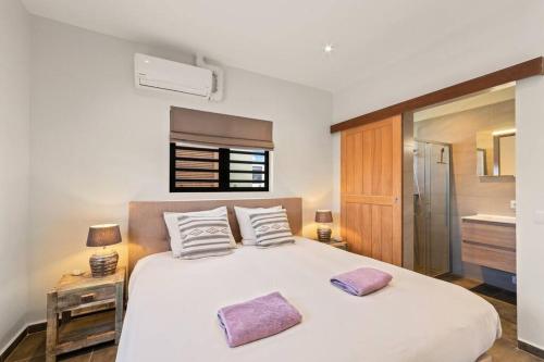 Llit o llits en una habitació de Villa Sunbeam
