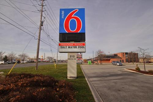 a gas station sign on the side of a road at Motel 6-London, ON - Ontario in London