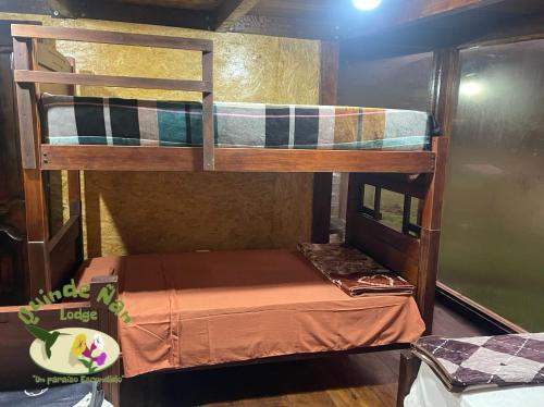 Ένα ή περισσότερα κρεβάτια σε δωμάτιο στο Quinde Ñan Lodge