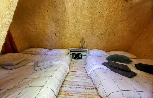a group of beds in a room at Quinta da Choupana in Tomar