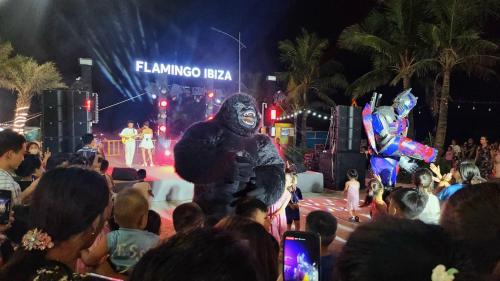 a person in a gorilla suit on a stage with a crowd at FLAMING0 Ibiza Hải Tiến Resort in Thanh Hóa