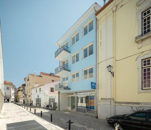 a blue building on the side of a street at Azul Downtown Apartments in Coimbra