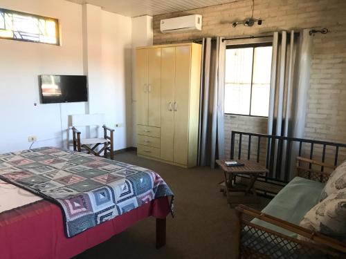 Una cama o camas en una habitación de Casa Loro