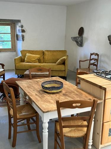 a living room with a table and chairs and a couch at HAIXPIA in Hasparren