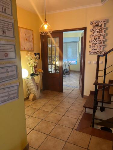 a hallway with a door and a tile floor at Relaxing Guesthouse - Sónias Houses in Lisbon