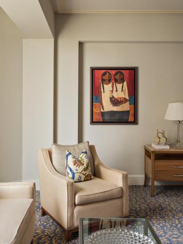 a living room with a chair and a painting at Miraflores Park, A Belmond Hotel, Lima in Lima