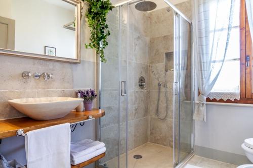 a bathroom with a sink and a shower at Tenuta Fiumara in Marina di Grosseto