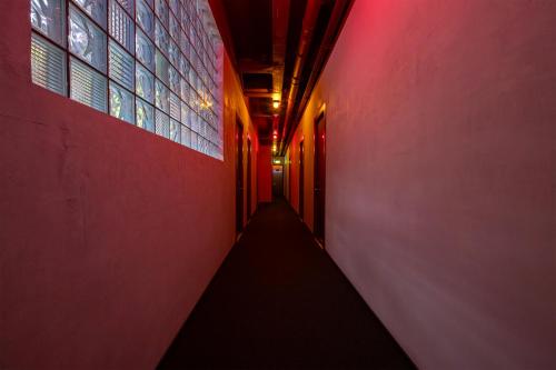 a hallway with a red light in a building at Rotel Kutaisi in Kutaisi