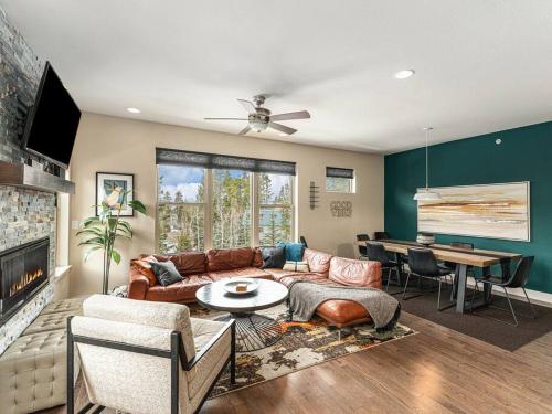 a living room with a couch and a table at Rendezvous - 99 Stagecoach in Fraser