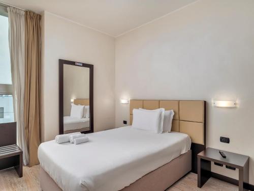 Postel nebo postele na pokoji v ubytování B&B HOTEL Park Hotel Cassano