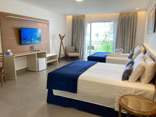 Cama ou camas em um quarto em Beach Hotel Juquehy
