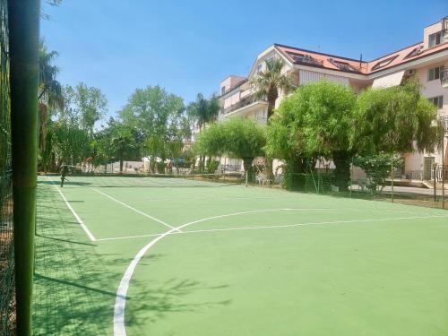 a tennis court in front of a building at Griseo - Sicily Vista in Calatabiano