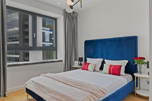 Ένα ή περισσότερα κρεβάτια σε δωμάτιο στο Aviation Tower Luxury Apartments