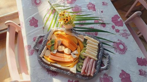 a plate of food on top of a table at Pousada Brasil Paraty in Paraty