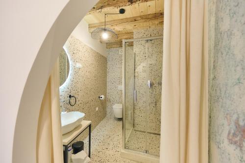 a bathroom with a shower and a sink at Villa Porta no in Bale
