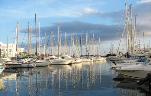 a bunch of boats docked in a harbor at Sousse Marina Kantaoui l'expérience côtière in Port El Kantaoui
