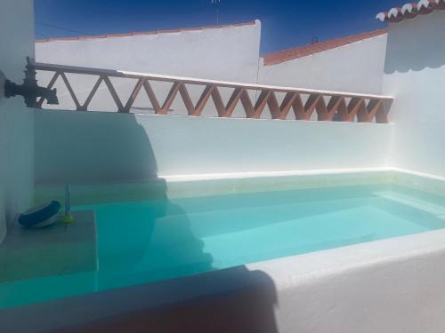 a bridge over a swimming pool in a house at Casa Vó Briata in Mértola